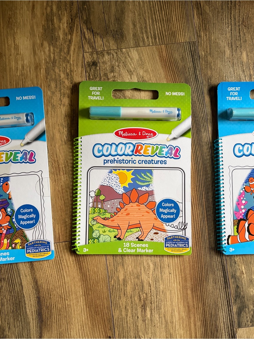 Melissa & Doug Color Reveal Prehistoric Creatures Activity Book - Green, Blue